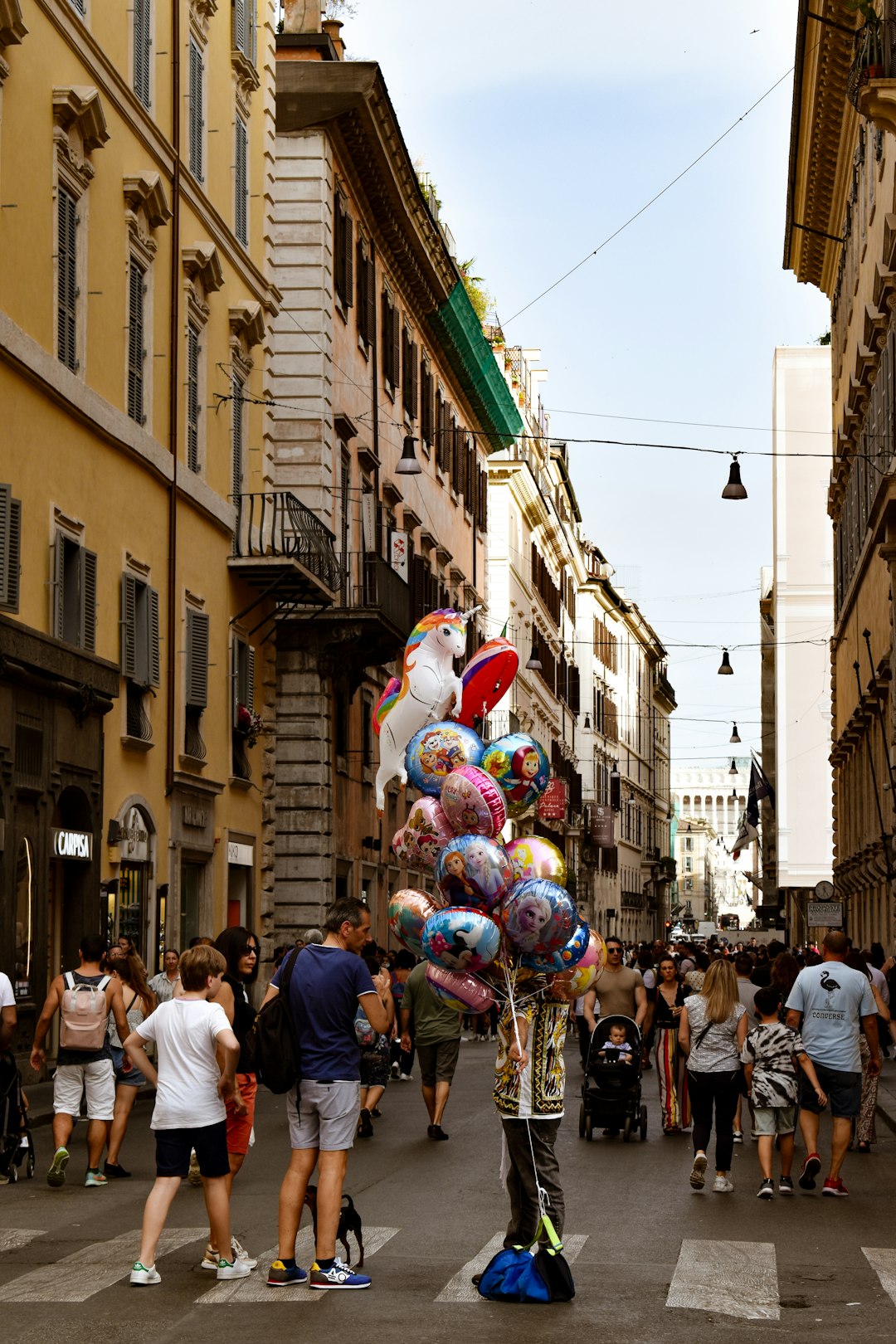 Italian village piazza decorated with flower petals for religious festival procession