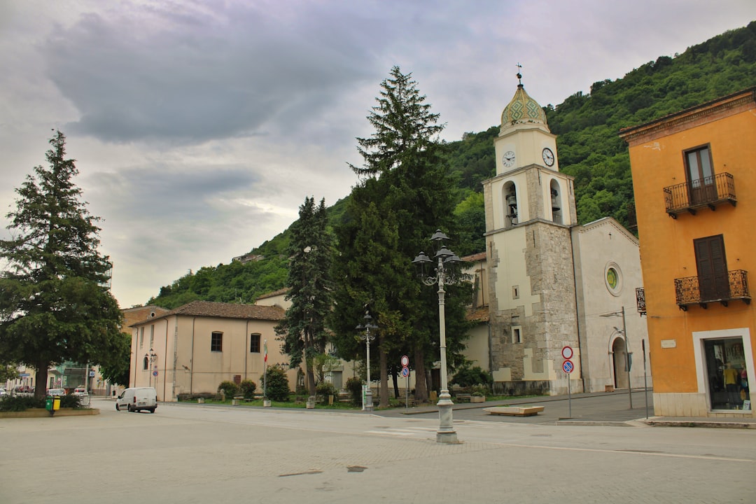 Baroque church with bell tower in the village square of Calcata, Lazio